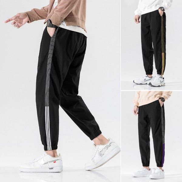 Autumn casual pants men's Korean fashion loose 9-point toe binding fashion brand versatile 3-bar sports pants men's 