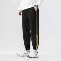 Autumn casual pants men's Korean fashion loose 9-point toe binding fashion brand versatile 3-bar sports pants men's 