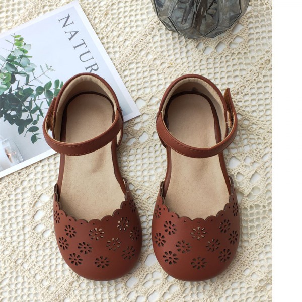 Guangzhou high grade children's shoes 2020 new Korean fresh laser hollow out sandals girls' hollow Baotou Princess sandals